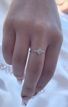 Load image into Gallery viewer, The radiant cubic zirconia stones that adorn the head of the ring transforms it into a luxurious piece of accessory any woman will want on their finger. Hand-polished to perfection, you will love wearing this ring on its own or stacking it with other pieces to make the look more unique. Material: 925 Sterling Silver, Cubic Zirconia Design: Star Weight: 1.0g