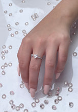 Load image into Gallery viewer, The large heart-shaped head is made from premium quality cubic zirconia, radiating the same beautiful reflection you will get from a lavish diamond. Hand-polished to perfection, you will love wearing this ring on its own or stacking it with other pieces to make the look more unique. Material: 925 Sterling Silver, Cubic Zirconia Design: Heart Weight: 1.7g