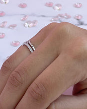 Load image into Gallery viewer, Symbolizing the duality of a silver ring, this double line ring features two contrasting lines that give off a unique yet familiar aura.. Further enhancing this idea is the head connecting both lines with a large round brilliant cubic zirconia.Material: 925 Sterling Silver, Cubic Zirconia Design: Round Weight: 1.9g