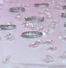 Load image into Gallery viewer, Adorned with brilliant cubic zirconia stones that radiate stunning light that is comparable to diamonds, this ring is perfect as a single piece or as part of a beautiful stack. Hand-polished to perfection, you will love wearing this ring on its own or stacking it with other pieces to make the look more unique. Material: 925 Sterling Silver, Cubic Zirconia Design: Round Weight: 1.8g