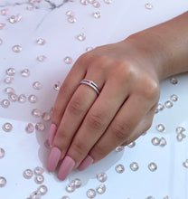 Load image into Gallery viewer, Symbolizing the duality of a silver ring, this double line ring features two contrasting lines that give off a unique yet familiar aura.. Further enhancing this idea is the head connecting both lines with a large round brilliant cubic zirconia.Material: 925 Sterling Silver, Cubic Zirconia Design: Round Weight: 1.9g