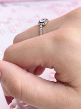 Load image into Gallery viewer, Three slim prongs surrounded by scintillating cubic zirconia stones form a heart-shaped head. This ring is a tangible representation of love and its many beautiful facets. The piece features a slender silhouette that is ideal for the woman who is never afraid to stand out through her unique personality. Material: 925 Sterling Silver, Cubic Zirconia Design: Heart Weight: 2.10g