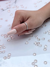 Load image into Gallery viewer, Adorned with brilliant cubic zirconia stones that radiate stunning light that is comparable to diamonds, this ring is perfect as a single piece or as part of a beautiful stack. Hand-polished to perfection, you will love wearing this ring on its own or stacking it with other pieces to make the look more unique. Material: 925 Sterling Silver, Cubic Zirconia Design: Round Weight: 1.8g