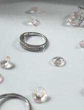 Load image into Gallery viewer, Adorned with brilliant cubic zirconia stones, the piece will melt the heart of anyone who will receive it from their significant other. Hand-polished to perfection, you will love wearing this ring on its own or stacking it with other pieces to make the look more unique.  Material: 925 Sterling Silver, Cubic Zirconia  Design: Circle  Weight: 1.6g
