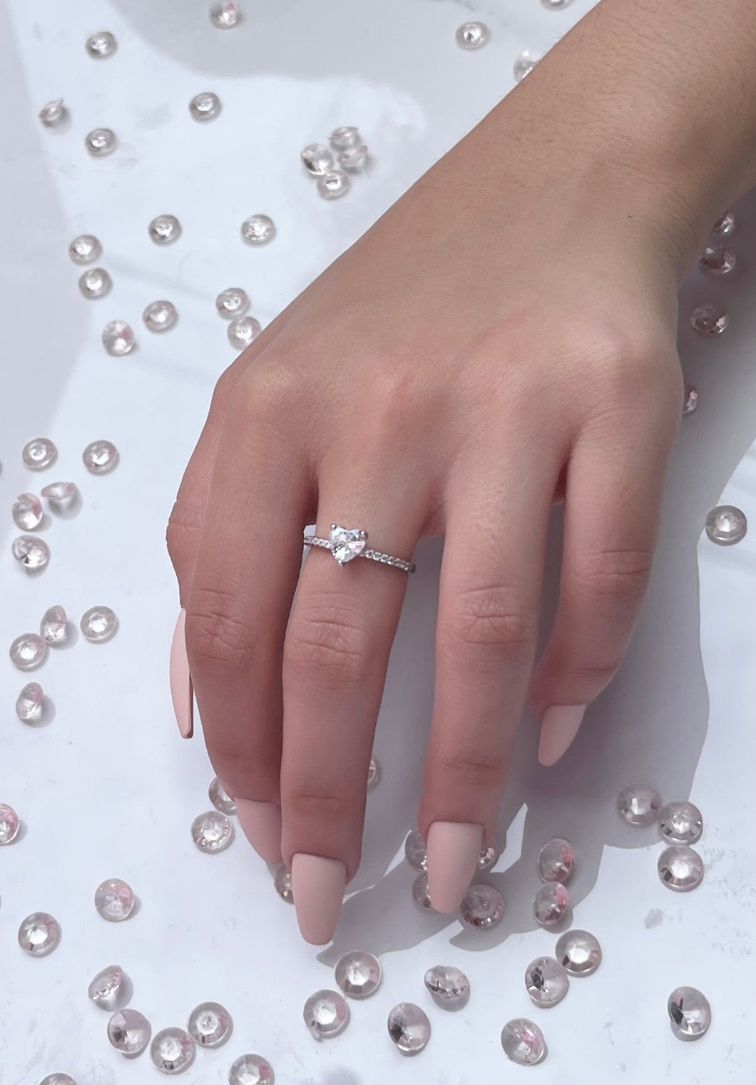 The large heart-shaped head is made from premium quality cubic zirconia, radiating the same beautiful reflection you will get from a lavish diamond. Hand-polished to perfection, you will love wearing this ring on its own or stacking it with other pieces to make the look more unique.  Material: 925 Sterling Silver, Cubic Zirconia  Design: Heart  Weight: 1.7g