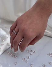Load image into Gallery viewer, Adorned with brilliant cubic zirconia stones, the piece will melt the heart of anyone who will receive it from their significant other. Hand-polished to perfection, you will love wearing this ring on its own or stacking it with other pieces to make the look more unique.  Material: 925 Sterling Silver, Cubic Zirconia  Design: Circle  Weight: 1.6g
