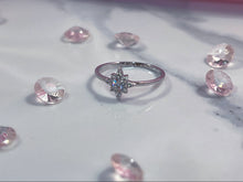 Load image into Gallery viewer,  The radiant cubic zirconia stones that adorn the head of the ring transforms it into a luxurious piece of accessory any woman will want on their finger. Hand-polished to perfection, you will love wearing this ring on its own or stacking it with other pieces to make the look more unique.  Material: 925 Sterling Silver, Cubic Zirconia  Design: Star  Weight: 1.0g
