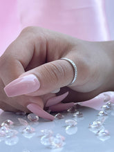 Load image into Gallery viewer,  Adorned with brilliant cubic zirconia stones that radiate stunning light that is comparable to diamonds, this ring is perfect as a single piece or as part of a beautiful stack. Hand-polished to perfection, you will love wearing this ring on its own or stacking it with other pieces to make the look more unique.  Material: 925 Sterling Silver, Cubic Zirconia  Design: Round  Weight: 1.8g
